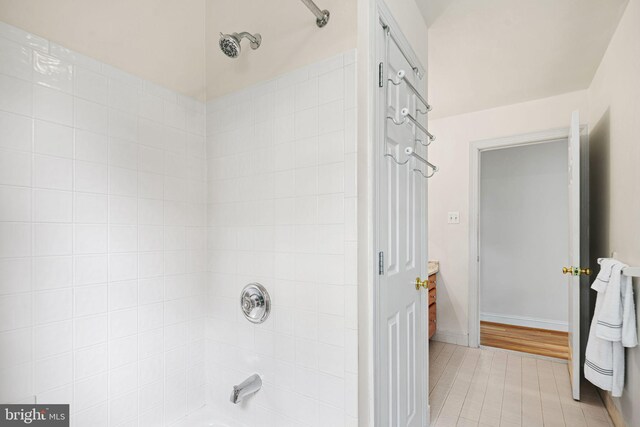 bathroom featuring shower / bath combination and tile patterned floors
