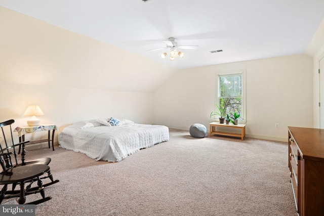 carpeted bedroom with a ceiling fan, baseboards, and vaulted ceiling
