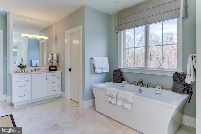 916 Prescott, Berwyn, PA 19312 - full bathroom featuring a freestanding tub, vanity, baseboards, and marble finish flooring