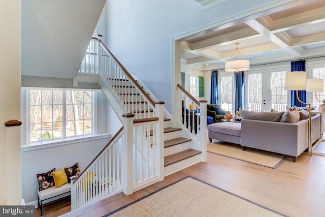 916 Prescott, Berwyn, PA 19312 - stairs with healthy amount of natural light, wood finished floors, coffered ceiling, and beamed ceiling