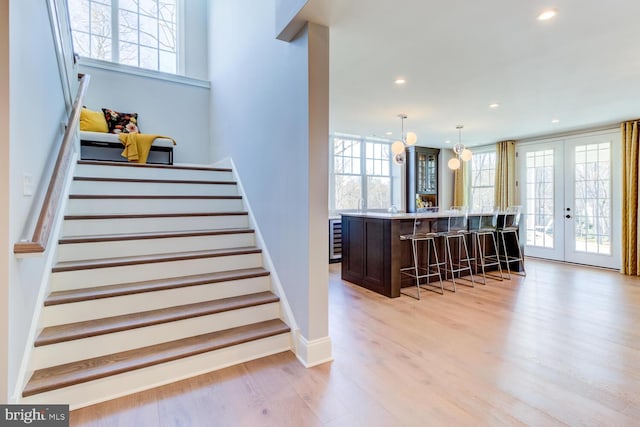 916 Prescott, Berwyn, PA 19312 - stairway with wood finished floors, recessed lighting, baseboards, french doors, and beverage cooler