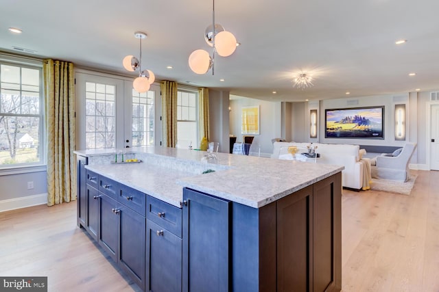 916 Prescott, Berwyn, PA 19312 - kitchen with baseboards, light wood finished floors, open floor plan, hanging light fixtures, and recessed lighting