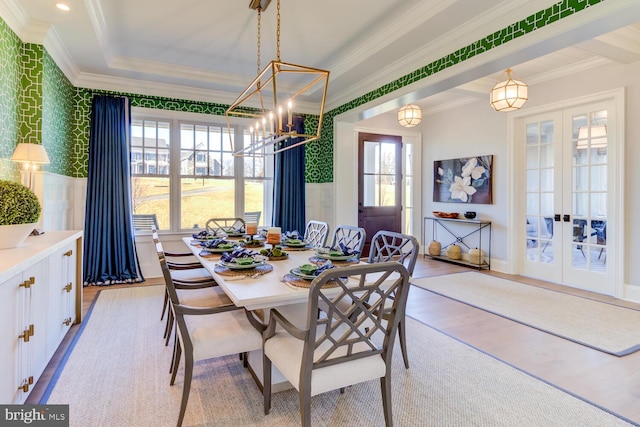 916 Prescott, Berwyn, PA 19312 - dining space featuring crown molding, french doors, wallpapered walls, light wood-type flooring, and a chandelier