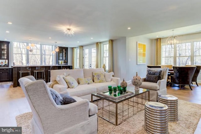 916 Prescott, Berwyn, PA 19312 - living area with plenty of natural light, light wood finished floors, recessed lighting, and a chandelier