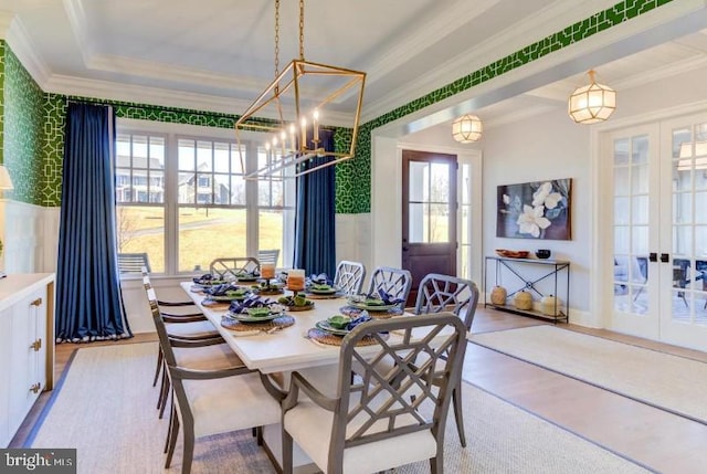 916 Prescott, Berwyn, PA 19312 - dining space with french doors, crown molding, wallpapered walls, a chandelier, and light wood-style flooring