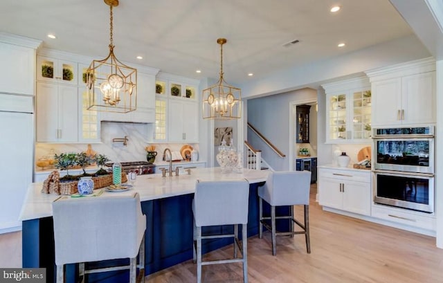 916 Prescott, Berwyn, PA 19312 - kitchen with double oven, a chandelier, white cabinetry, and recessed lighting