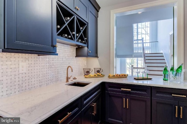 916 Prescott, Berwyn, PA 19312 - kitchen with a sink, healthy amount of natural light, tasteful backsplash, and light stone counters