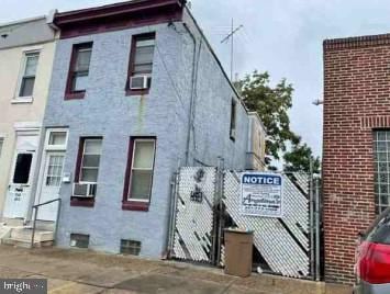 3550 Emerald St, Philadelphia, PA 19134 - view of side of property with a gate and fence