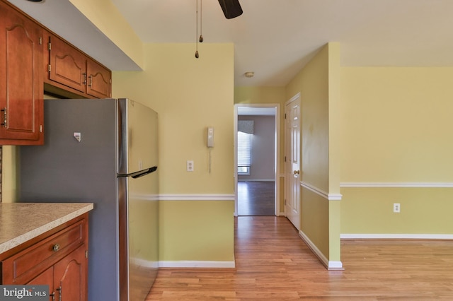 1514 Ravena St Unit D, Bethlehem, PA 18015 - kitchen with a ceiling fan, light countertops, baseboards, freestanding refrigerator, and light wood finished floors