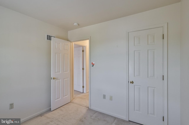 1514 Ravena St Unit D, Bethlehem, PA 18015 - unfurnished bedroom with visible vents, baseboards, and light carpet