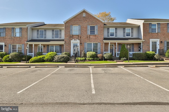 1514 Ravena St Unit D, Bethlehem, PA 18015 - view of front facade featuring uncovered parking and brick siding