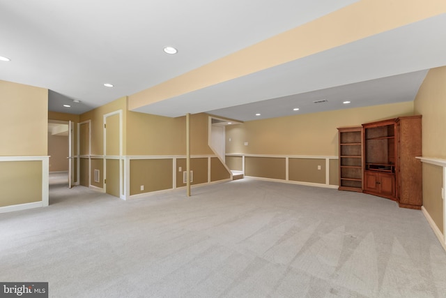 finished basement with light colored carpet, recessed lighting, and baseboards