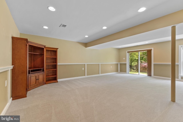unfurnished living room featuring recessed lighting, baseboards, and light colored carpet