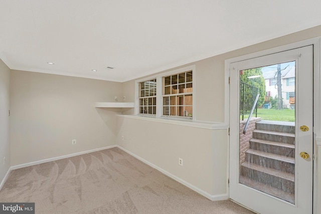doorway with baseboards and carpet floors