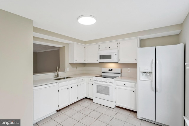kitchen featuring white appliances, a sink, light countertops, white cabinetry, and light tile patterned floors