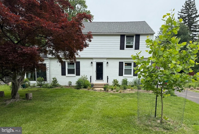 1708 Wrightfield Rd, Yardley, PA 19067 - colonial inspired home with a front yard, roof with shingles, entry steps, and brick siding