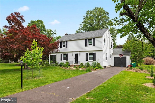 1708 Wrightfield Rd, Yardley, PA 19067 - colonial house featuring asphalt driveway, a chimney, a front yard, and a garage