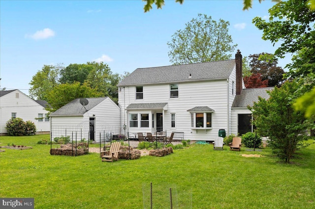1708 Wrightfield Rd, Yardley, PA 19067 - back of property featuring a chimney, a lawn, a patio area, and roof with shingles