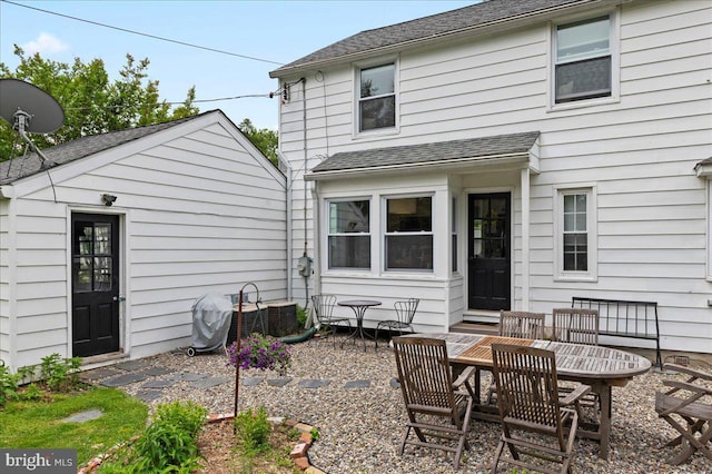 1708 Wrightfield Rd, Yardley, PA 19067 - back of house featuring a shingled roof and outdoor dining space