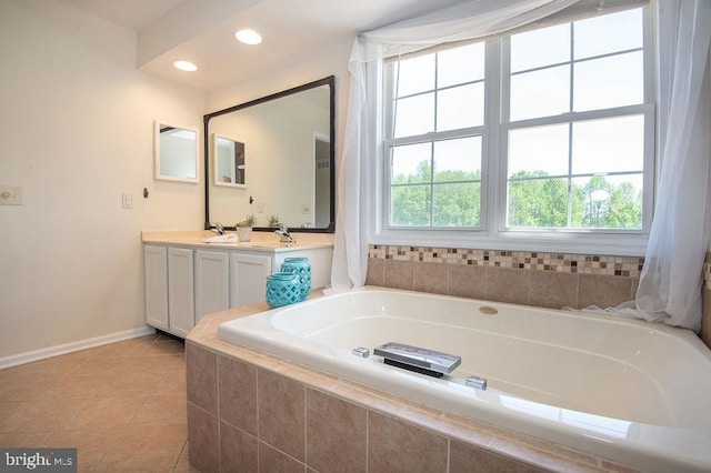 134 Ascot Ct, Bear, DE 19701 - bathroom with baseboards, tile patterned floors, a bath, double vanity, and recessed lighting