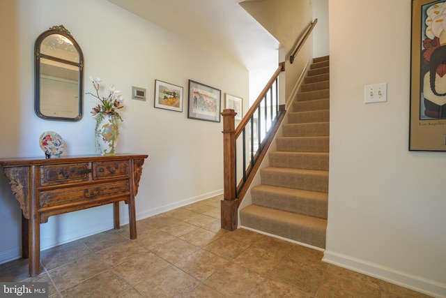 stairs featuring baseboards