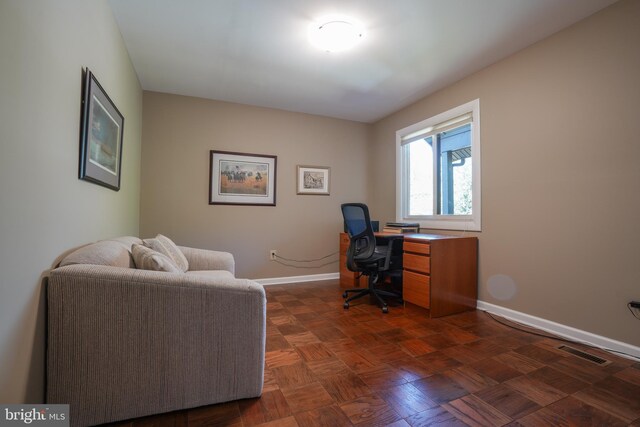 office area featuring baseboards and visible vents