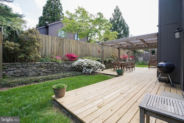 wooden terrace with outdoor dining area, a lawn, a fenced backyard, a pergola, and a grill