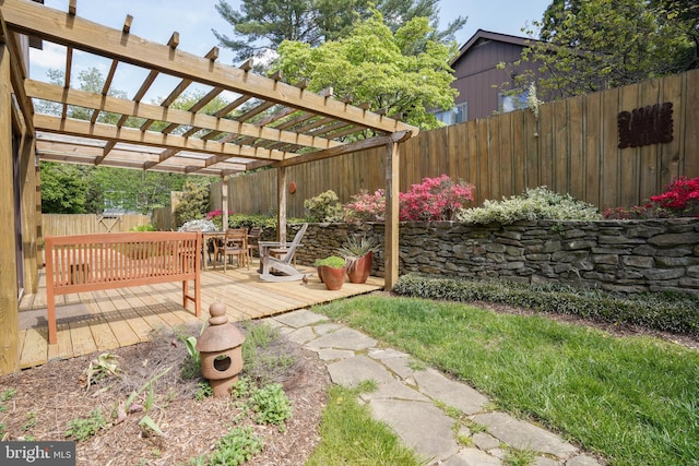 view of yard featuring a deck, a fenced backyard, and a pergola