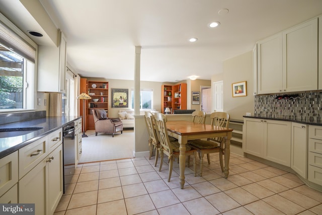 dining room with recessed lighting, light colored carpet, and light tile patterned floors
