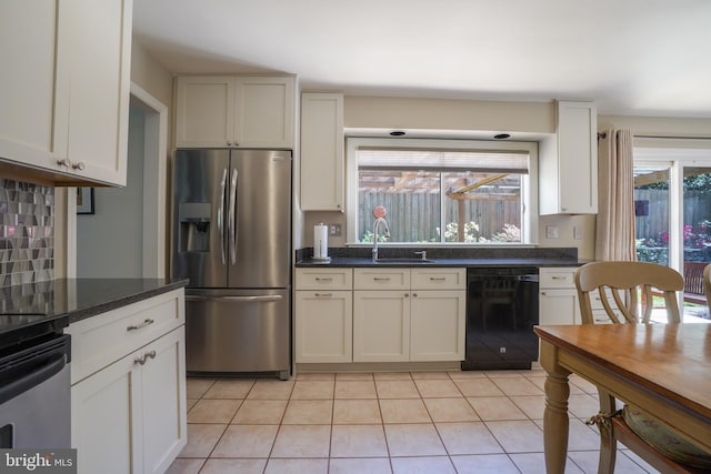 kitchen with light tile patterned flooring, black dishwasher, white cabinets, stainless steel fridge with ice dispenser, and a sink