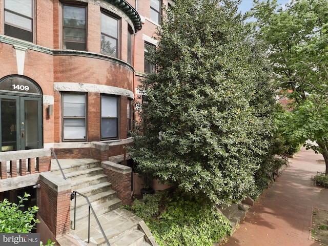 exterior space with brick siding