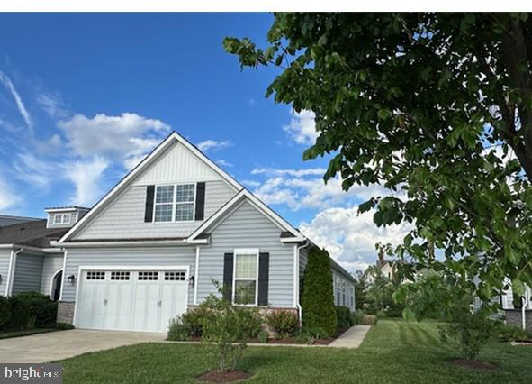 912 Moorings Cir Unit 8, Stevensville, MD 21666 - view of front facade featuring a front yard and driveway