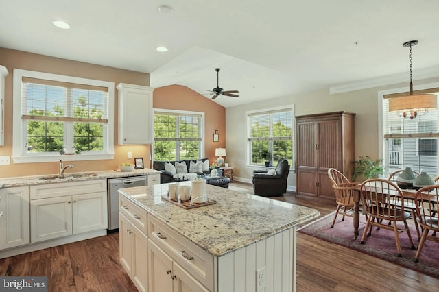 912 Moorings Cir Unit 8, Stevensville, MD 21666 - kitchen with stainless steel dishwasher, dark wood finished floors, ceiling fan, a sink, and light stone counters