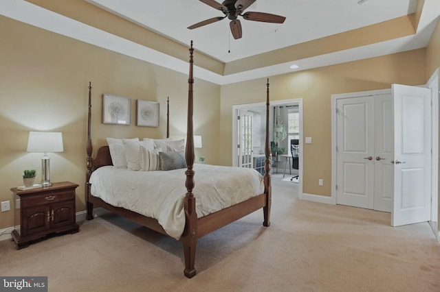 912 Moorings Cir Unit 8, Stevensville, MD 21666 - bedroom with light carpet, baseboards, a raised ceiling, recessed lighting, and ceiling fan