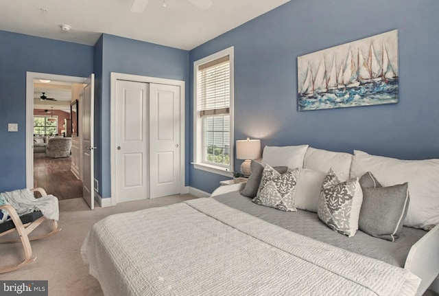 912 Moorings Cir Unit 8, Stevensville, MD 21666 - bedroom with a closet, baseboards, a ceiling fan, and carpet flooring