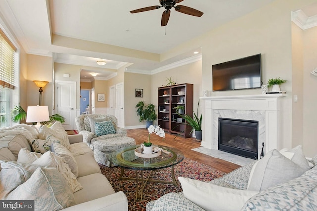 912 Moorings Cir Unit 8, Stevensville, MD 21666 - living area featuring ceiling fan, wood finished floors, ornamental molding, a high end fireplace, and baseboards