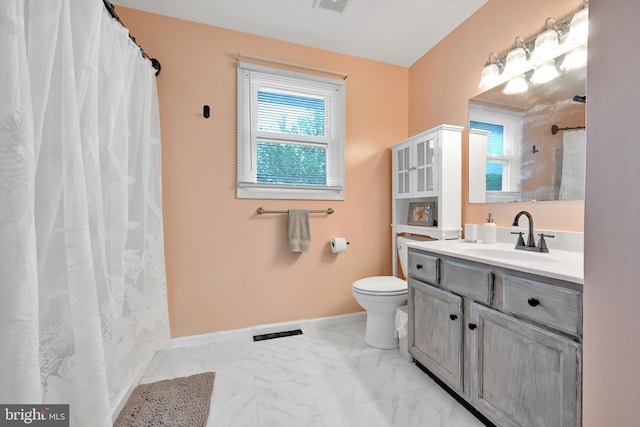 full bath with toilet, baseboards, marble look tiles, vanity, and a shower with shower curtain
