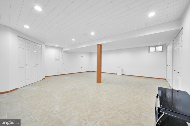 below grade area featuring recessed lighting, baseboards, and electric panel