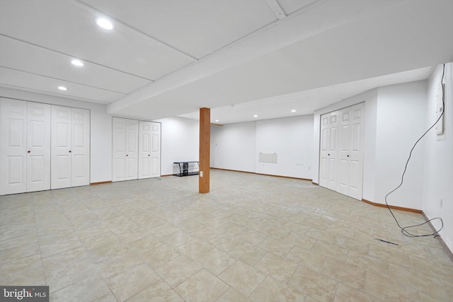 finished basement with recessed lighting and baseboards