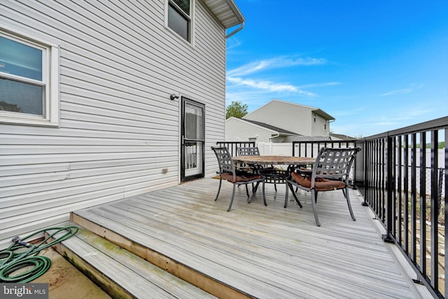 wooden deck with outdoor dining space