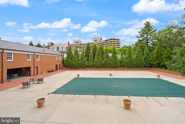 view of pool with a fenced in pool and a patio area