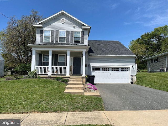 traditional home with covered porch, driveway, cooling unit, a front lawn, and an attached garage