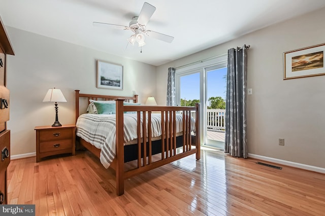 bedroom featuring light wood finished floors, access to exterior, a ceiling fan, baseboards, and visible vents