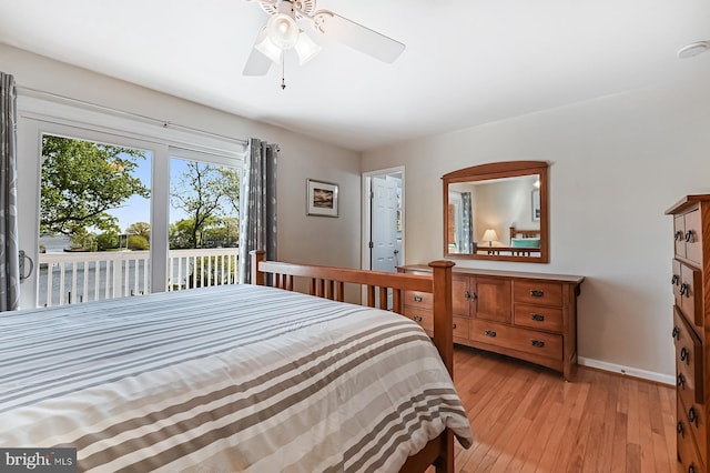 bedroom featuring baseboards, a ceiling fan, light wood-style flooring, and access to exterior