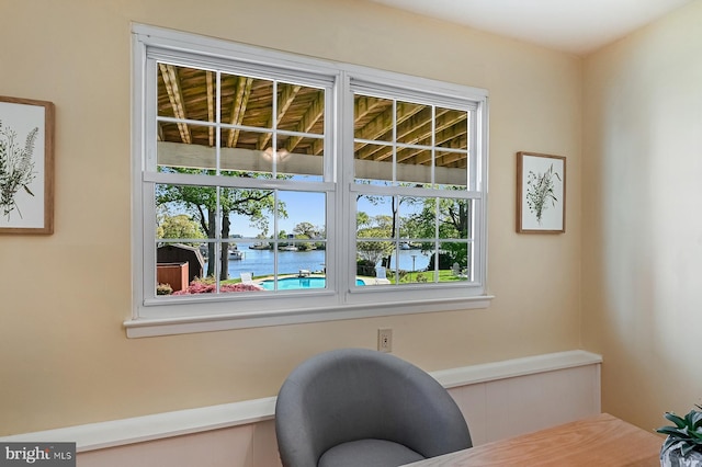 living area featuring a water view