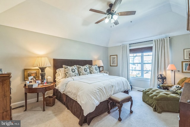 carpeted bedroom with baseboards, a ceiling fan, and vaulted ceiling