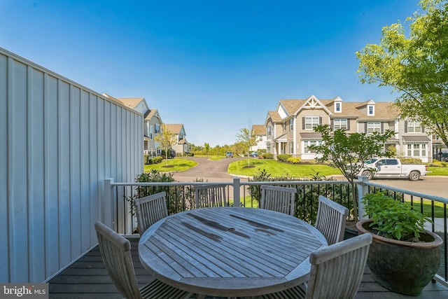 wooden terrace with a residential view