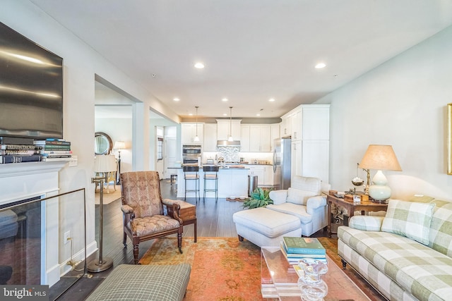 living room featuring recessed lighting and wood finished floors
