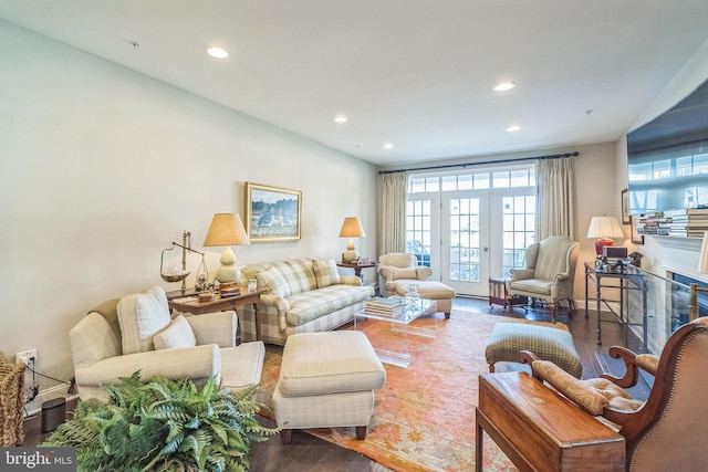 living area featuring recessed lighting, a healthy amount of sunlight, and wood finished floors