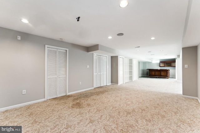 15533 Pamplin Pipe Ct, Manassas, VA 20112 - unfurnished living room featuring carpet, bar area, baseboards, and recessed lighting